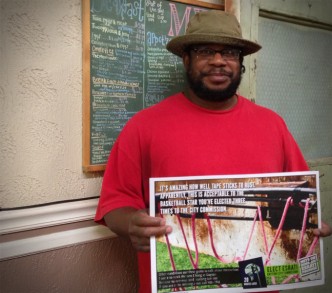 Al Shamburger holding Elect Esrati poster