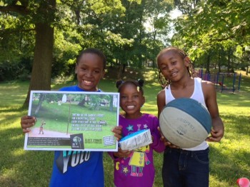 Photo of kids at Salem Heights park holding the Elect Esrati poster